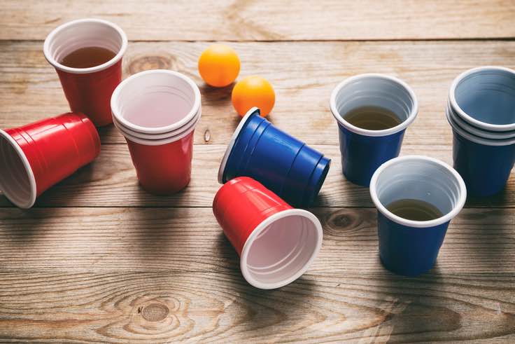 Blue and red cups, ping pong ball, beer pong