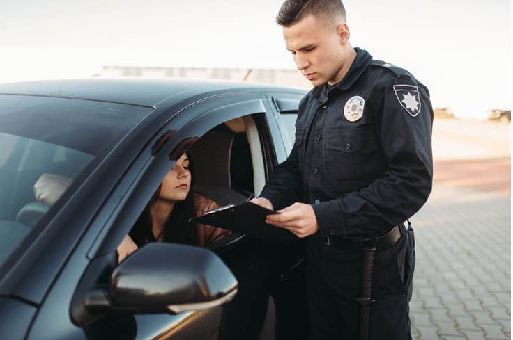 Traffic stop of teen girl driver by uniformed officer